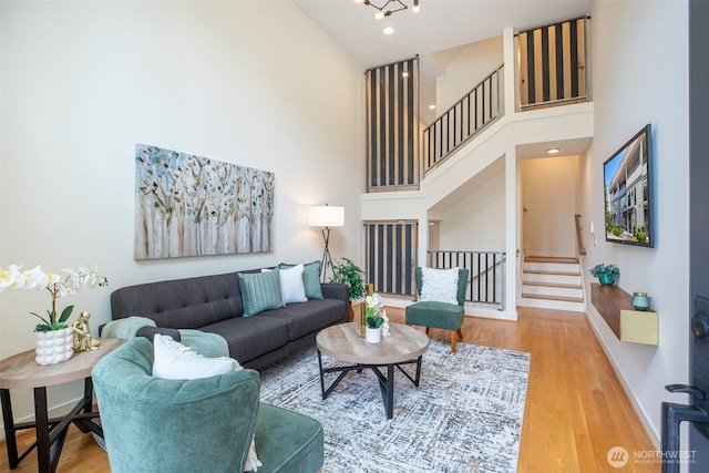 140 26th Ave E, Seattle, WA 98112 - living room featuring stairs, a high ceiling, and wood finished floors