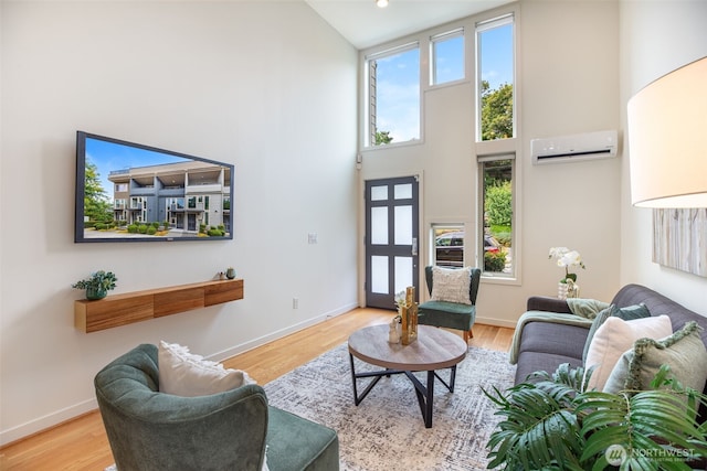 140 26th Ave E, Seattle, WA 98112 - living room with a wall unit AC, a towering ceiling, wood finished floors, and recessed lighting