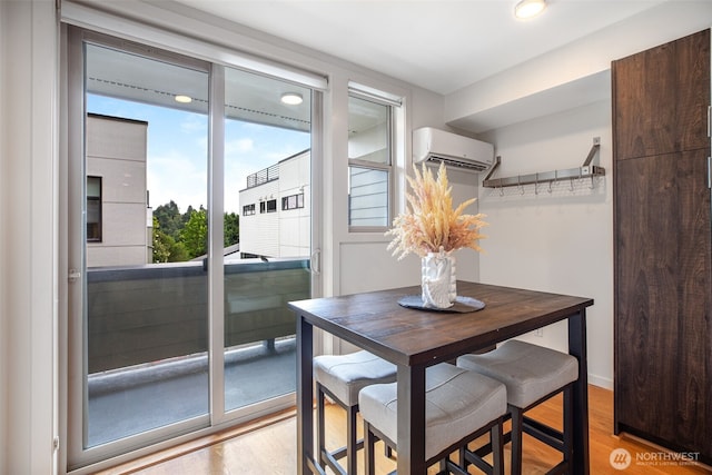 140 26th Ave E, Seattle, WA 98112 - dining space featuring a wall mounted air conditioner, light wood-style floors, and recessed lighting