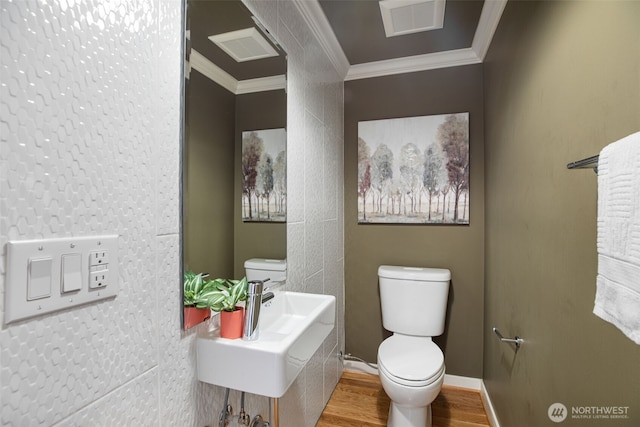140 26th Ave E, Seattle, WA 98112 - bathroom featuring ornamental molding and wood finished floors
