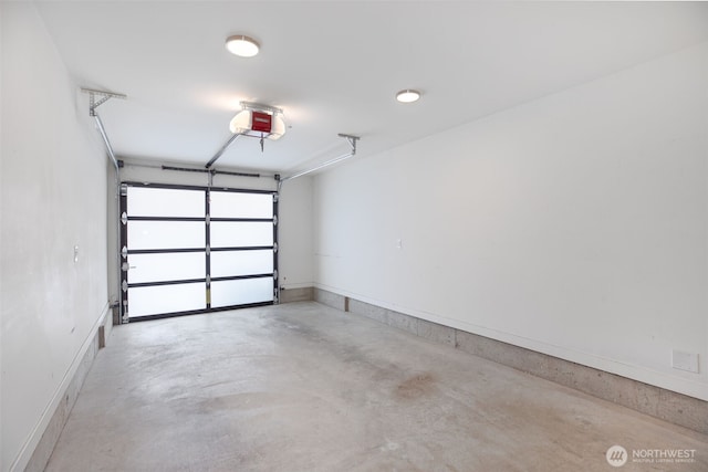 140 26th Ave E, Seattle, WA 98112 - garage with a garage door opener and baseboards