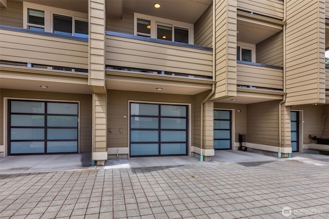 140 26th Ave E, Seattle, WA 98112 - property entrance with a balcony and an attached garage