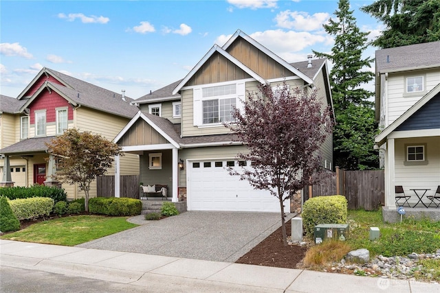16128 120th Ave NE, Bothell, WA 98011 - craftsman inspired home featuring board and batten siding, a garage, driveway, a shingled roof, and covered porch