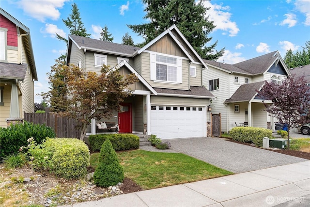16128 120th Ave NE, Bothell, WA 98011 - view of front facade featuring board and batten siding, asphalt driveway, an attached garage, and roof with shingles