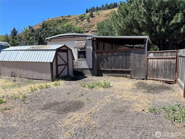 1201 S 2nd St, Dayton, WA 99328 - view of property exterior featuring a storage shed, a metal roof, and a mountain view
