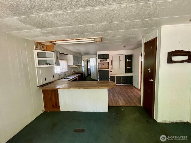 1201 S 2nd St, Dayton, WA 99328 - kitchen with a peninsula and dark colored carpet
