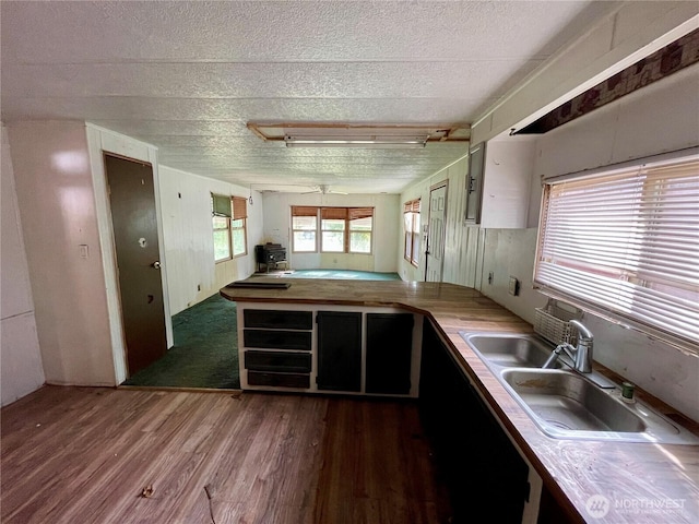 1201 S 2nd St, Dayton, WA 99328 - kitchen featuring wood finished floors, a textured ceiling, butcher block counters, and ceiling fan
