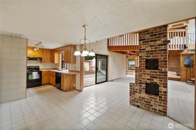 31312 179th Pl SE, Auburn, WA 98092 - kitchen featuring black appliances, light countertops, open floor plan, under cabinet range hood, and a textured ceiling