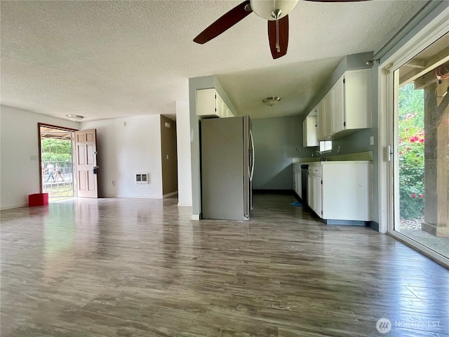 4301 NE 137th Ave, Vancouver, WA 98682 - kitchen featuring freestanding refrigerator, a textured ceiling, dark wood-type flooring, white cabinets, and a ceiling fan