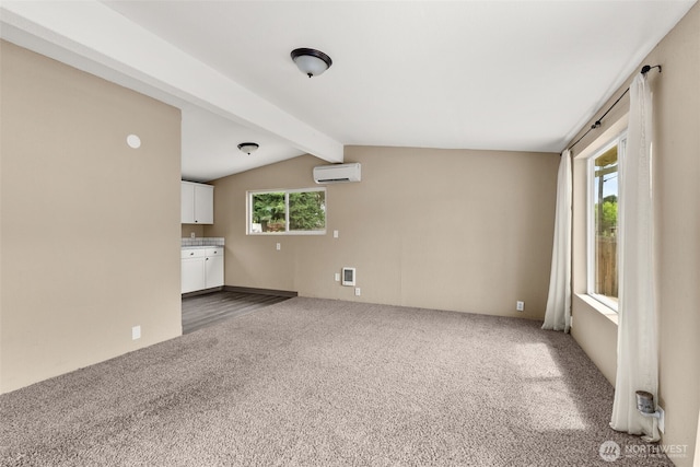 1428 S 4th Ave, Kelso, WA 98626 - unfurnished living room featuring carpet flooring and an AC wall unit