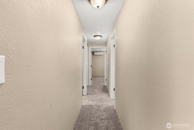 1428 S 4th Ave, Kelso, WA 98626 - hallway with carpet, a wall mounted air conditioner, and a textured wall