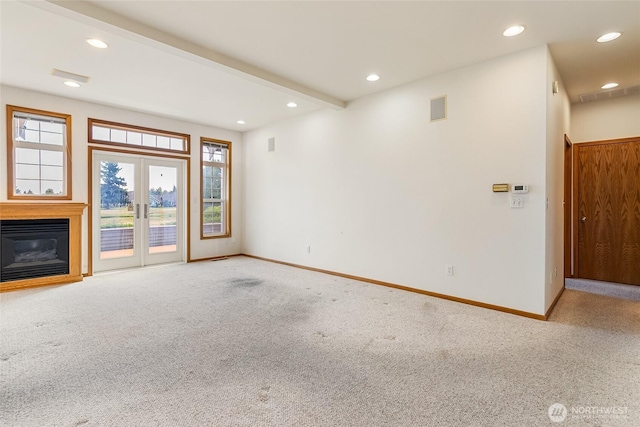 114 Twin Sister Loop, Lynden, WA 98264 - unfurnished living room featuring carpet floors, recessed lighting, a glass covered fireplace, and french doors