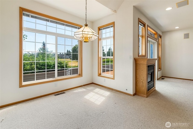 114 Twin Sister Loop, Lynden, WA 98264 - unfurnished dining area with light carpet, a chandelier, a glass covered fireplace, and recessed lighting
