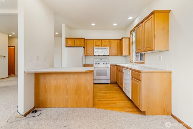114 Twin Sister Loop, Lynden, WA 98264 - kitchen featuring white appliances, a peninsula, recessed lighting, light countertops, and light carpet