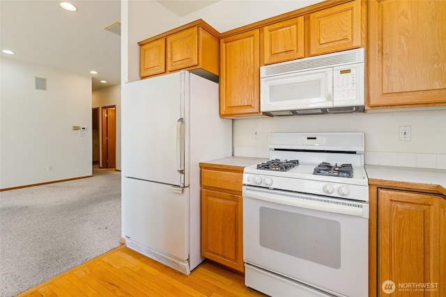 114 Twin Sister Loop, Lynden, WA 98264 - kitchen featuring white appliances, light countertops, recessed lighting, light wood-style flooring, and brown cabinets