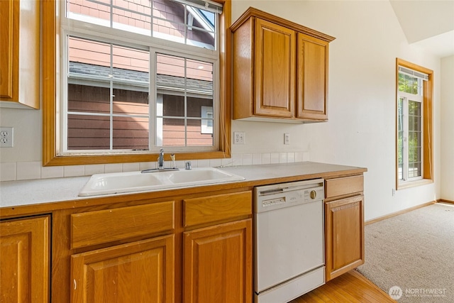 114 Twin Sister Loop, Lynden, WA 98264 - kitchen featuring white dishwasher, brown cabinetry, light countertops, and light carpet