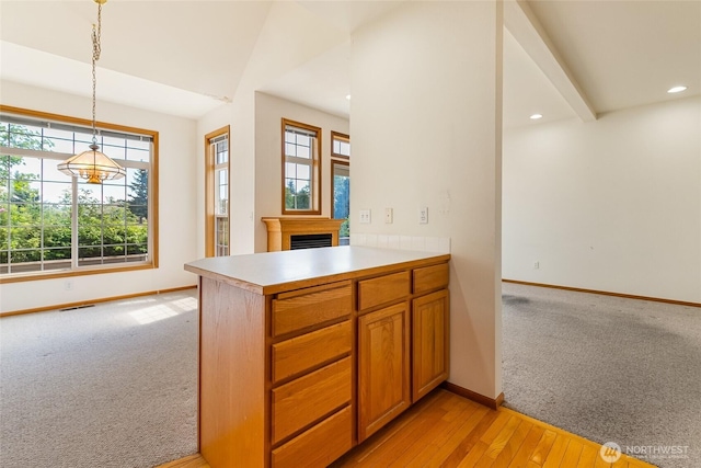 114 Twin Sister Loop, Lynden, WA 98264 - kitchen featuring light colored carpet, light countertops, a fireplace, recessed lighting, and hanging light fixtures
