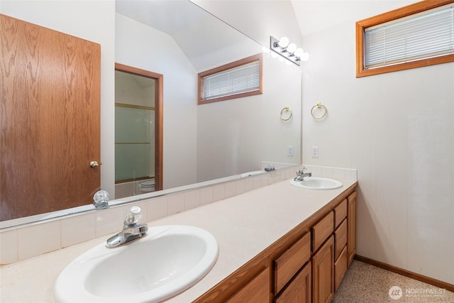 114 Twin Sister Loop, Lynden, WA 98264 - bathroom featuring double vanity, vaulted ceiling, and a shower with door