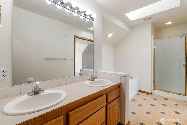 114 Twin Sister Loop, Lynden, WA 98264 - bathroom with a skylight, a garden tub, a shower stall, double vanity, and recessed lighting