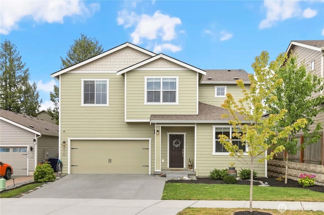 28515 76th Dr NW, Stanwood, WA 98292 - view of front facade featuring driveway, a garage, and a shingled roof