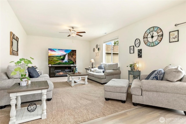 28515 76th Dr NW, Stanwood, WA 98292 - living area with ceiling fan, wood finished floors, and a glass covered fireplace