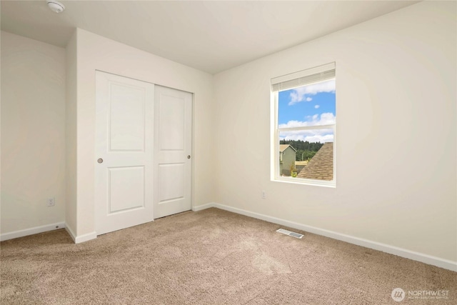 28515 76th Dr NW, Stanwood, WA 98292 - unfurnished bedroom with carpet floors and a closet