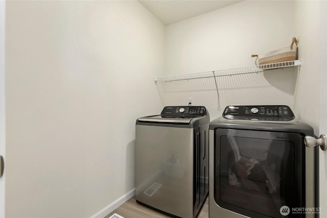 28515 76th Dr NW, Stanwood, WA 98292 - laundry room with separate washer and dryer and light wood finished floors