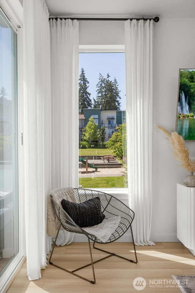 14646 35th Ct NE, Lake Forest Park, WA 98155 - doorway with radiator, healthy amount of natural light, and wood finished floors