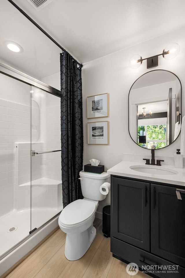 14646 35th Ct NE, Lake Forest Park, WA 98155 - full bathroom featuring a stall shower, vanity, and wood finished floors
