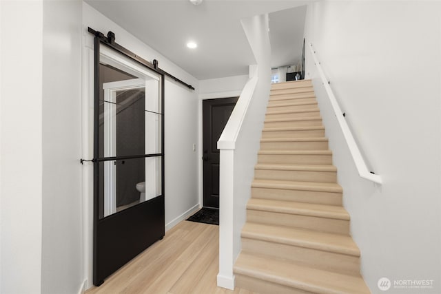 14646 35th Ct NE, Lake Forest Park, WA 98155 - staircase featuring wood finished floors, a barn door, and recessed lighting