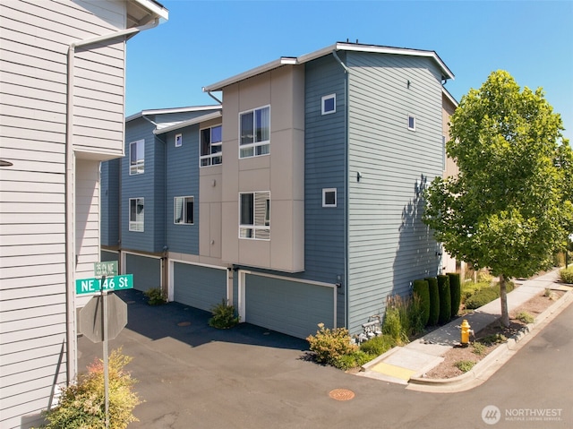 14646 35th Ct NE, Lake Forest Park, WA 98155 - view of property exterior with a garage and driveway