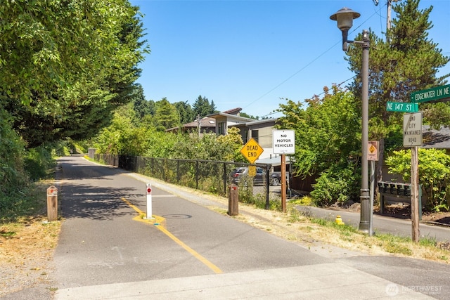14646 35th Ct NE, Lake Forest Park, WA 98155 - view of asphalt street featuring traffic signs and street lights