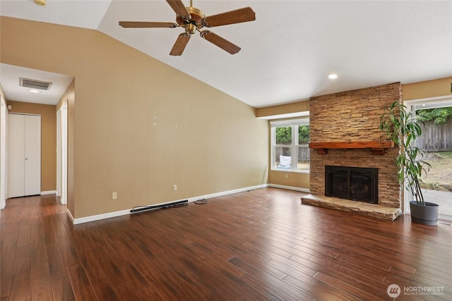 13940 113th Ave NE, Kirkland, WA 98034 - unfurnished living room with wood finished floors, vaulted ceiling, a ceiling fan, and a stone fireplace
