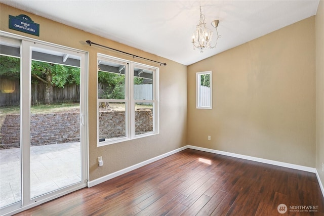 13940 113th Ave NE, Kirkland, WA 98034 - unfurnished room with dark wood-style flooring, a chandelier, and vaulted ceiling