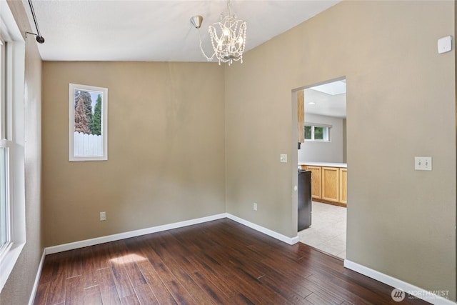 13940 113th Ave NE, Kirkland, WA 98034 - spare room featuring dark wood-style floors and a chandelier