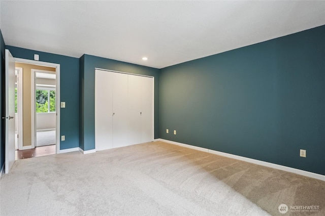 13940 113th Ave NE, Kirkland, WA 98034 - unfurnished bedroom with carpet flooring, a closet, and recessed lighting