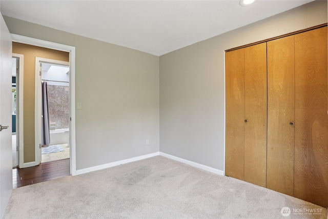 13940 113th Ave NE, Kirkland, WA 98034 - unfurnished bedroom featuring carpet floors and a closet