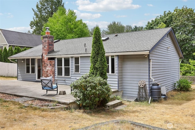 13940 113th Ave NE, Kirkland, WA 98034 - rear view of house featuring a shingled roof, a chimney, and a wooden deck