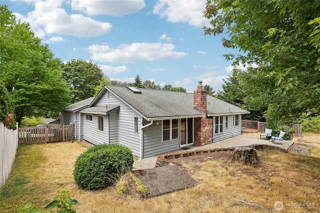 13940 113th Ave NE, Kirkland, WA 98034 - rear view of property with a chimney, a patio area, a fenced backyard, and a shingled roof