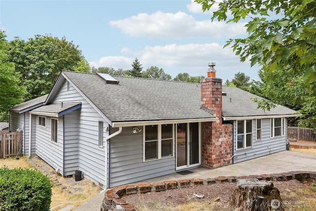 13940 113th Ave NE, Kirkland, WA 98034 - back of property featuring a patio, roof with shingles, and a chimney