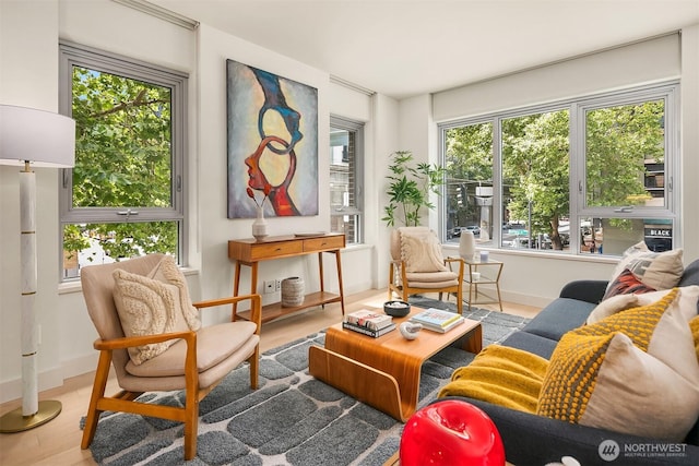 583 Battery St Unit 212N, Seattle, WA 98121 - sitting room featuring plenty of natural light and wood finished floors