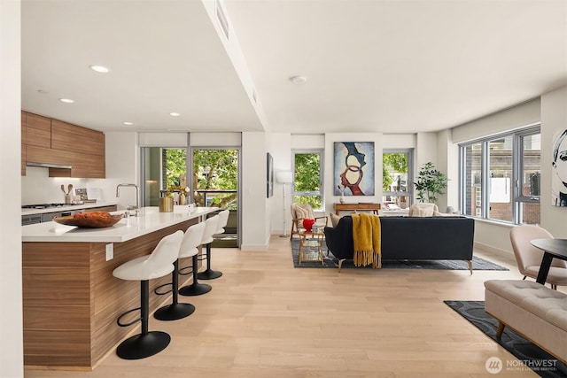 583 Battery St Unit 212N, Seattle, WA 98121 - living area featuring light wood finished floors and recessed lighting