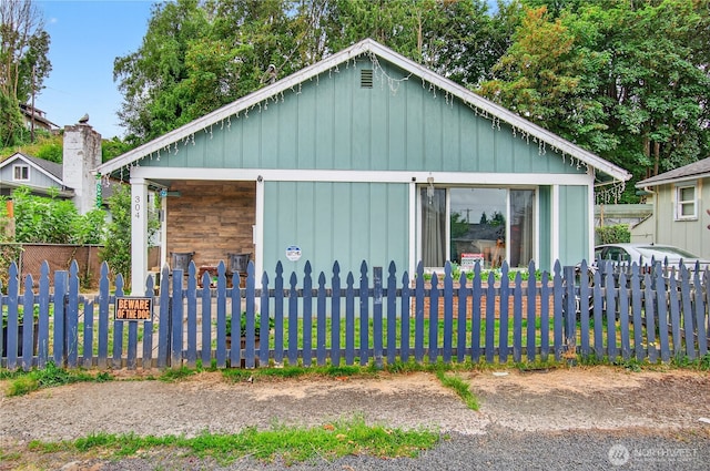 304 Harris St, Kelso, WA 98626 - view of side of home featuring a fenced front yard and board and batten siding