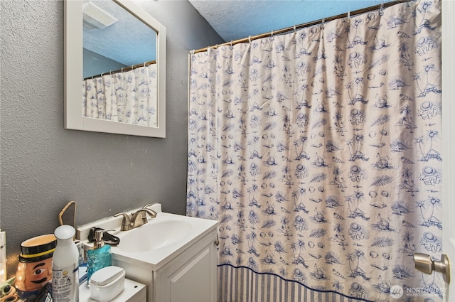 304 Harris St, Kelso, WA 98626 - bathroom with a textured wall, vanity, and curtained shower