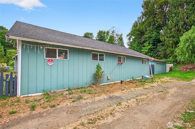 304 Harris St, Kelso, WA 98626 - view of home's exterior with a detached garage and a shingled roof