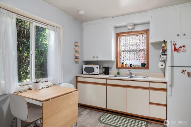 11341136 16th Ave, Longview, WA 98632 - kitchen featuring white appliances, light countertops, and white cabinets
