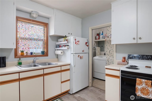 11341136 16th Ave, Longview, WA 98632 - kitchen featuring electric range, washer / clothes dryer, freestanding refrigerator, and light countertops