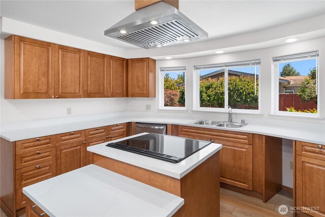 2289 Towne Point Ave, Port Townsend, WA 98368 - kitchen with island range hood, dishwasher, brown cabinets, a kitchen island, and light countertops