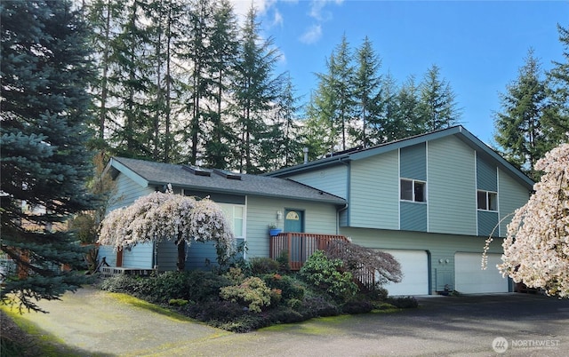 933 Fern St SW, Olympia, WA 98502 - view of front of house featuring a garage and driveway
