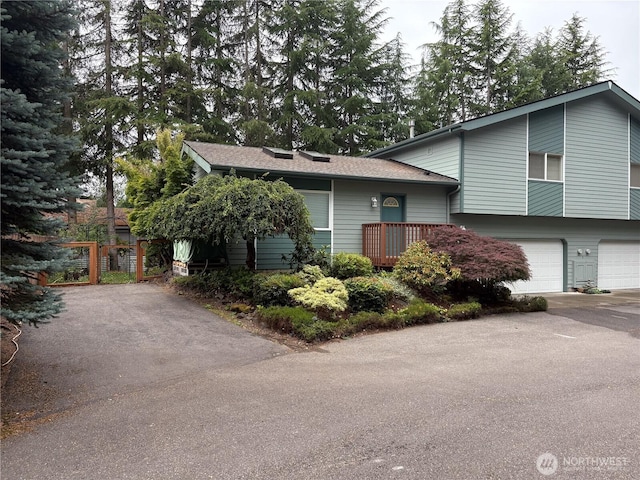 933 Fern St SW, Olympia, WA 98502 - split level home featuring a garage and driveway